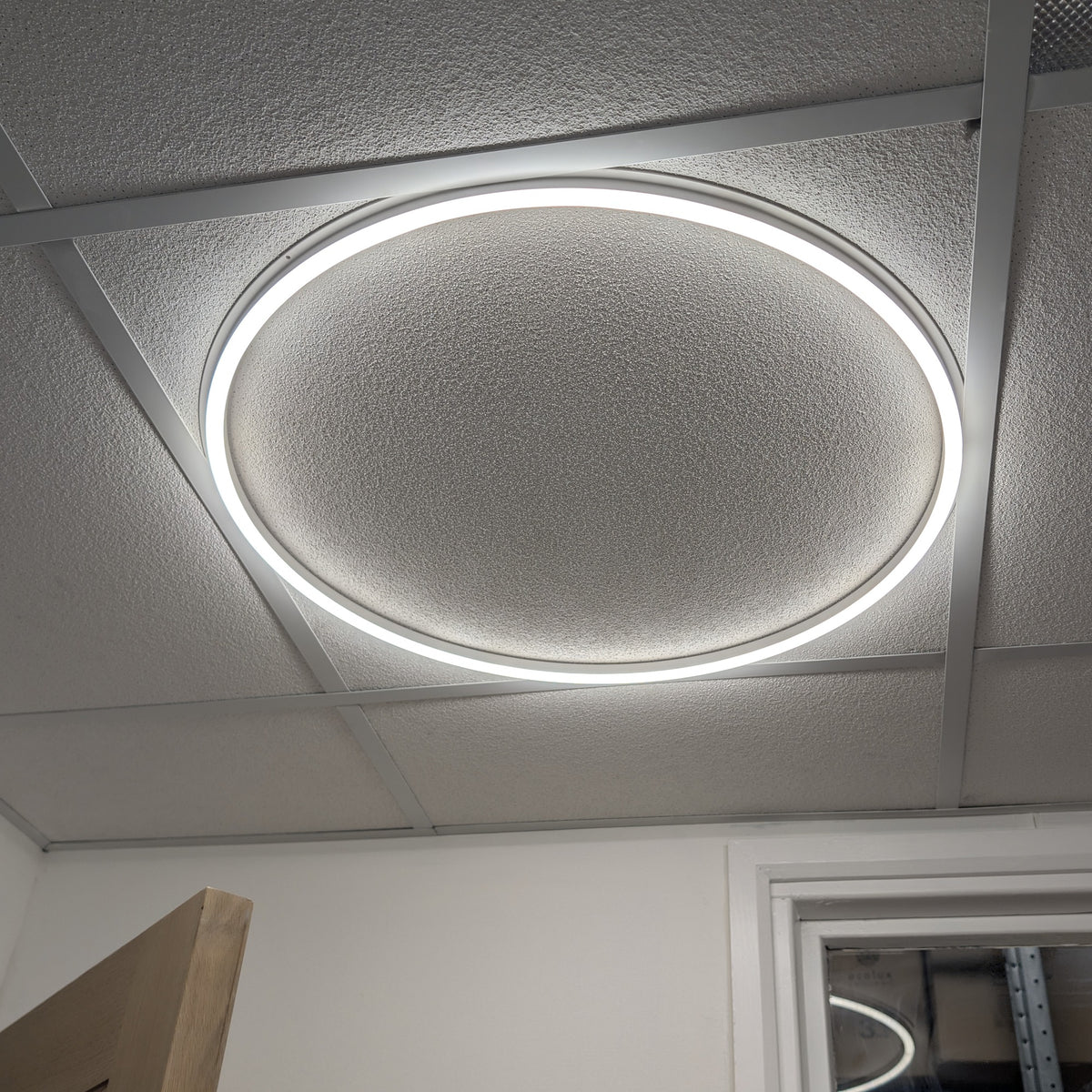 Round Halo LED Linear Frame Light in use, lit in a real office ceiling