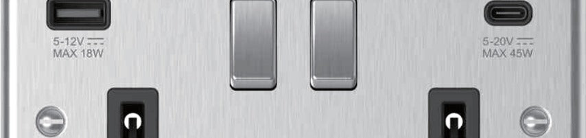 Close-up of brushed steel USB socket USB-A and USB-C ports