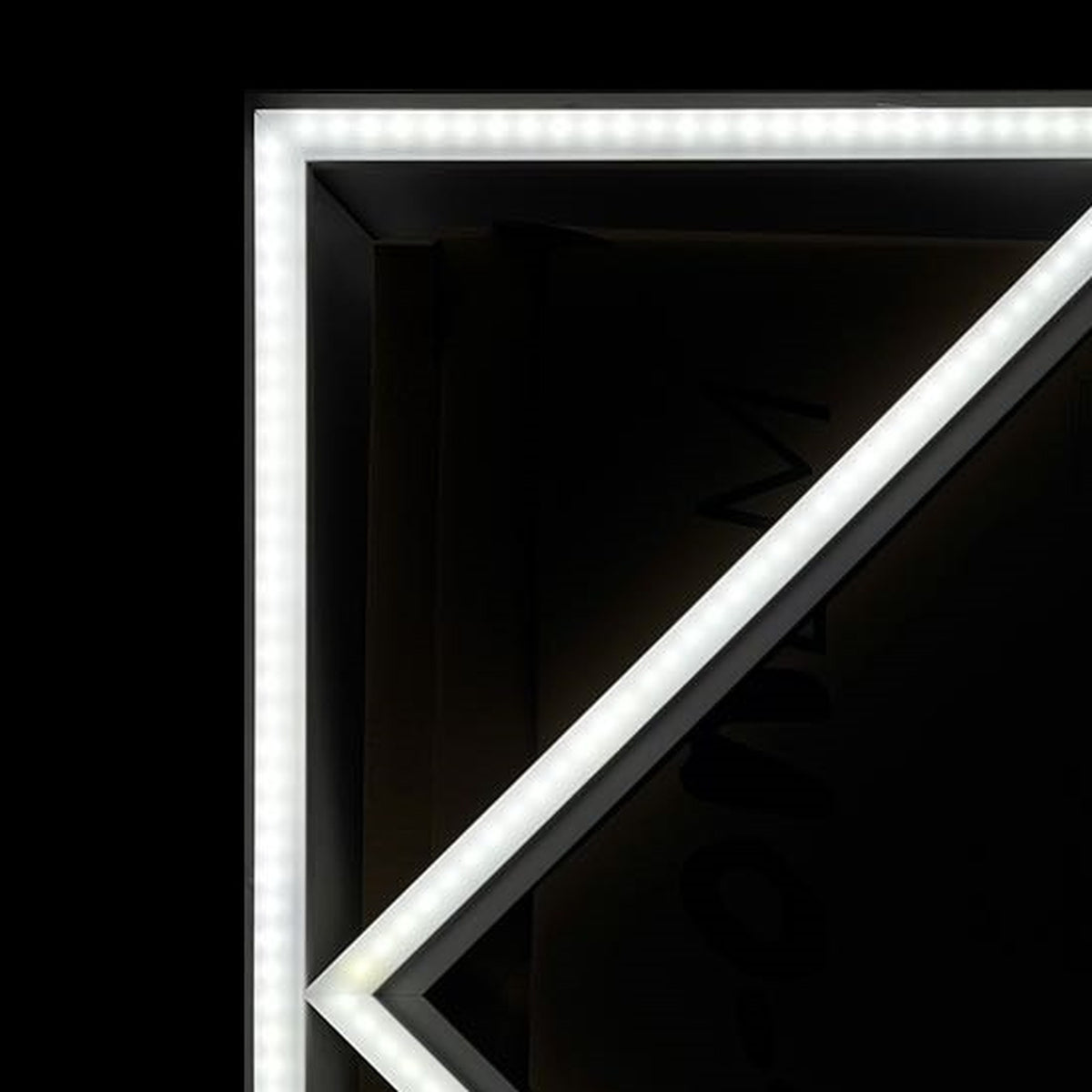 Close-up of the lit Diamond Linear Frame LED light corner showing LED dots along the frame