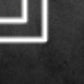 Close-up detail of the lit Greek-key linear pattern