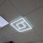 Greek Key LED Linear Frame Light installed and lit in a real ceiling grid