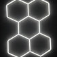 5-grid hexagon LED frame glowing on studio wall