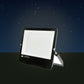 LED Dual Voltage Floodlight on a patio in the evening – lifestyle image, product unchanged