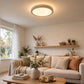 Round LED panel light installed on a modern living room ceiling