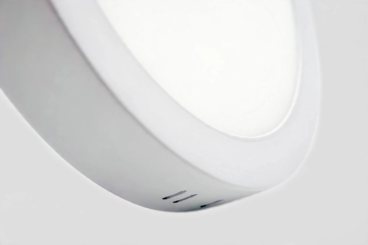 Close-up of the ultra-slim side profile of the round LED panel light